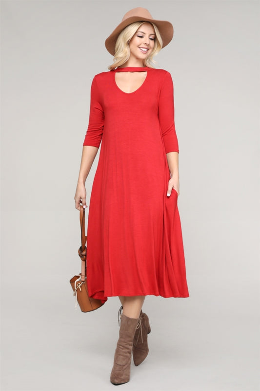 Knee-length ginger dress with flared skirt and choker-style collar, ideal for evening occasions